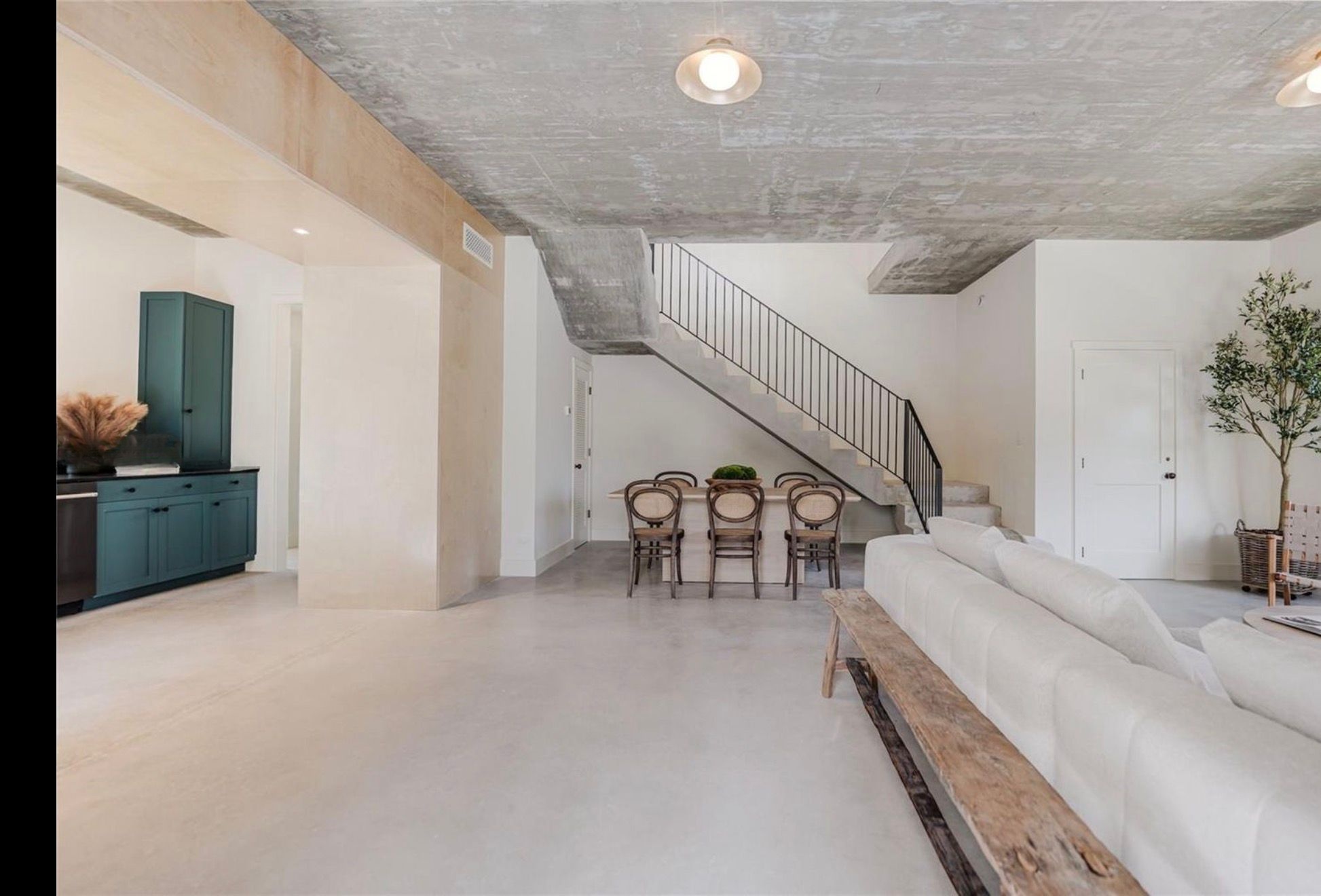Concrete stair and open-plan living